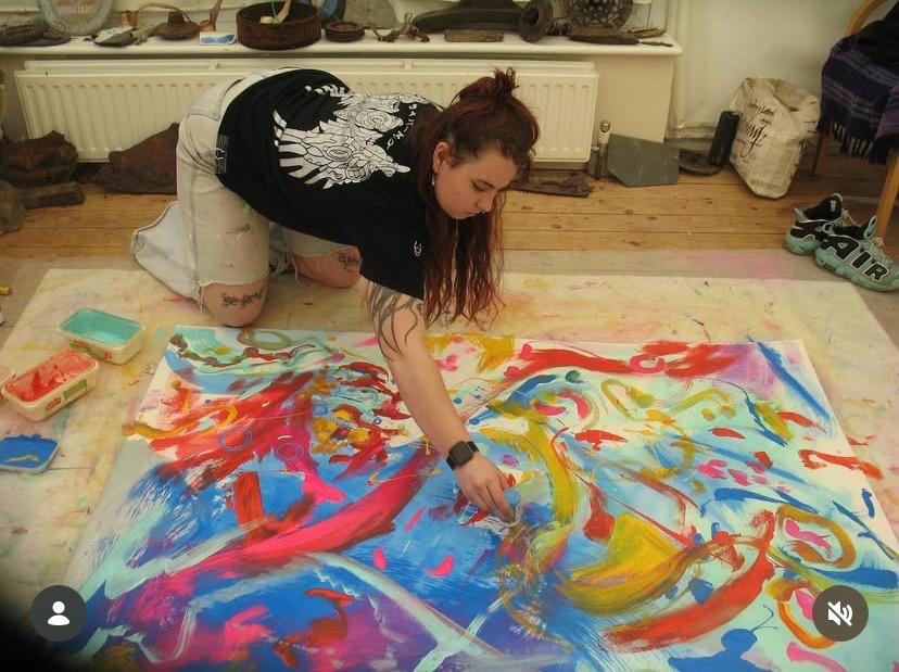 Kya painting in her studio